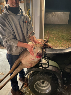 Beau Blust of Tawas City with a nice 8 point!  Beau's first deer with a bow!