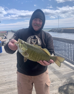 Rick Thompson of Tawas City - Nice smallmouth bass caught on a white curly tail jig.