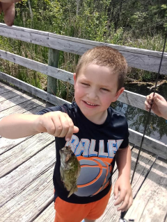 mason Rifenbark of Barton City with a Rock Bass
