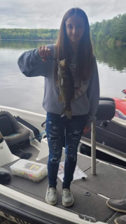 Kylie LaFreniere of Whittemore with her Small Mouth Bass