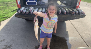 Emma Demanski from Roseville with her Walleye