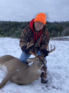 Ed Crainer of Whittemore with his Burleigh Twp. 8 point!