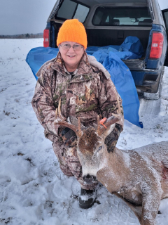 Diana DeGentenaar of Lupton with her Ogemaw County 8 Point!