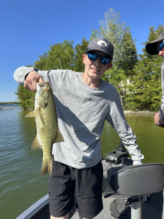 Zachary Lorenz with his Bass caught on Long Lake.
