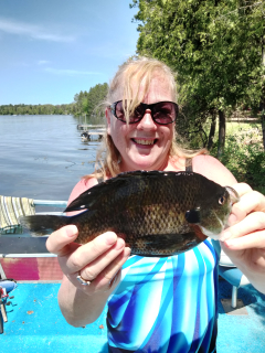 Kathi Gushen of Saginaw with a nice Alcona Dam Pond Bluegill