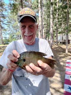 Daivid Gushen of Saginaw with his Alcona Dam Pond Bluegill