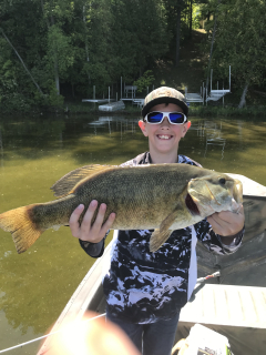 Gage Ploof of Tawas City with his Small Mouth Bass caught in Hale!