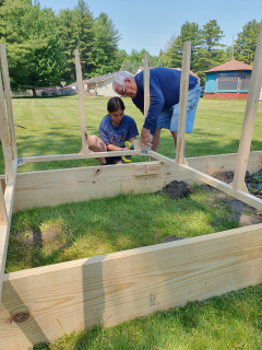 Sophie Pezel, East Tawas nominates Dad Richard Simmons!  Grandpa and Granddaughter building garden bed together