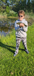 Luke Brooks  of East Tawas Shows off his Bass caught in Tawas City
