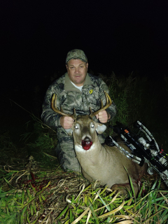 Mike Badour from Standish bagged his 10 point in Arenac County!   My daughter has been hunting every day since October 1st. She had to attend a work meeting on the 18th so I decided I would hunt in her blind and use her Ten Point crossbow. After passing up smaller bucks I finally saw this 10 point come to about 40 yards and stop so I took a shot. He ran less than 60 yards and dropped. I sent my daughter a picture of myself, the 10 point buck and her crossbow while at her work meeting. 