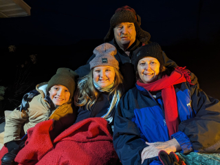 Dawn & LeeRoy LaLonde of Black River, Caroling on the wagon he built