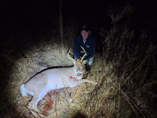Wes Chrivia from Whittemore Pictured with hios 8 point shot in Sherman Twp!
