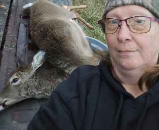 Beth Bennett from Tawas Bagged her Doe in Tawas!