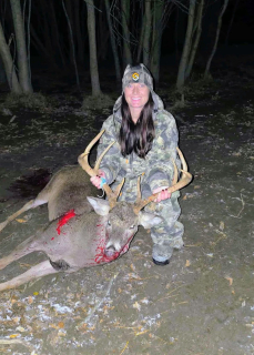 Alecia Bishoff from Tawas City bagged an 8 point in Tawas city!  This big guy ran across the field to chase a doe!